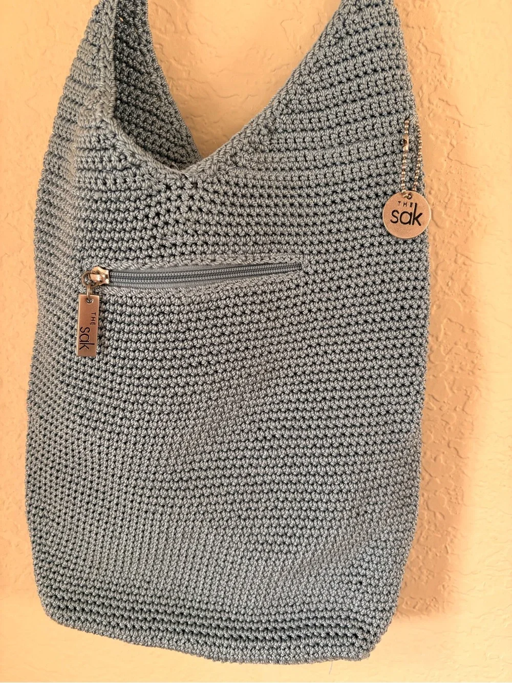 The Sak Light Gray Crochet Crossbody with Logo Charm